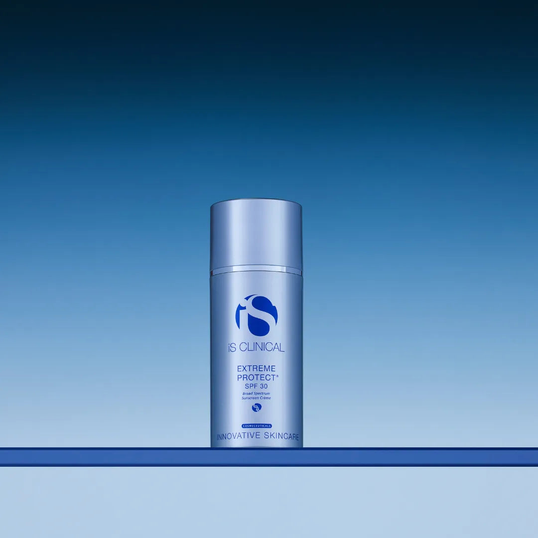 iS Clinical Extreme Protect SPF 30 sunscreen bottle on a blue gradient