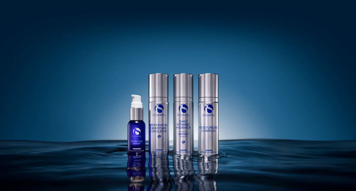 Four iS Clinical hydration products standing in reflective water with blue gradient background