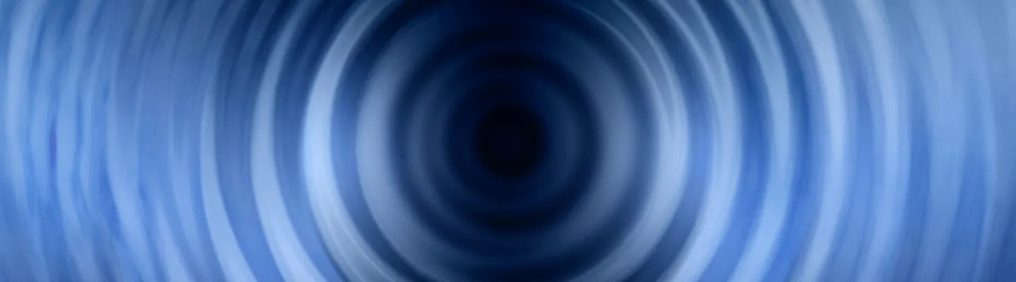 Abstract blue concentric circles creating a tunnel effect with gradient shading