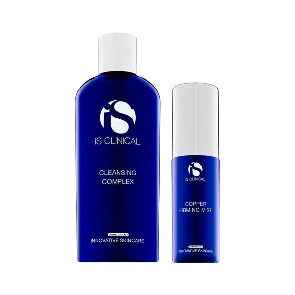 Two blue iS Clinical bottles with white caps labelled Cleansing Complex and Copper Firming Mist on white background