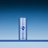 iS Clinical Extreme Protect SPF 30 sunscreen bottle on a blue gradient