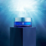 Blue jar of iS Clinical Hydra-Intensive Cooling Masque with silver lid on a dark pedestal