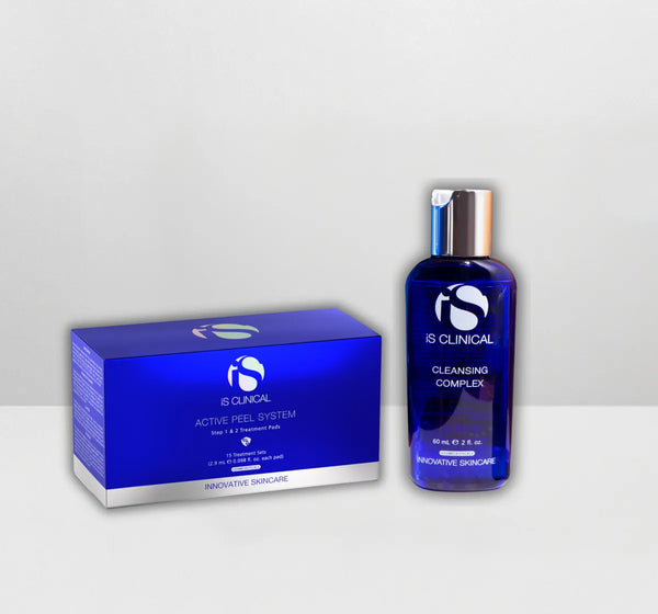 iS Clinical Active Peel System box and Cleansing Complex blue bottle with silver cap on white surface