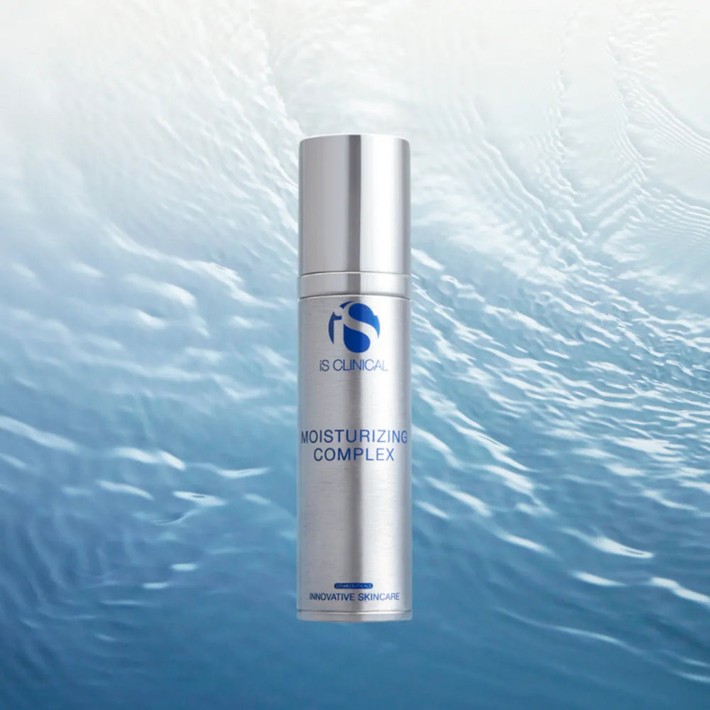Silver pump bottle of iS Clinical Moisturizing Complex with blue text on water ripple background