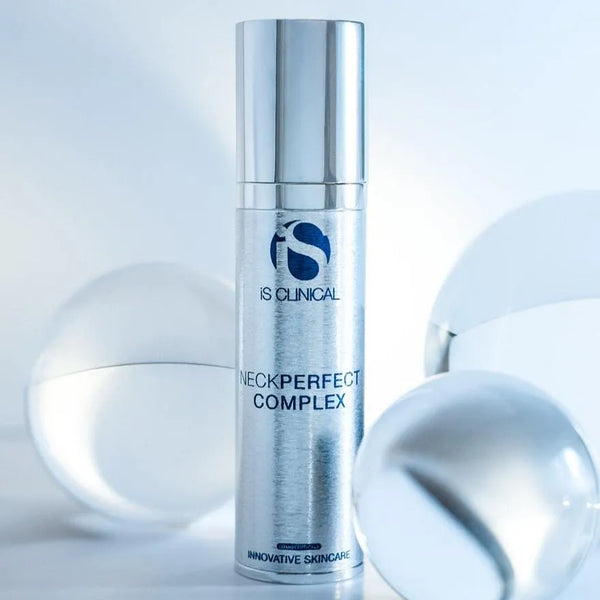 Silver cylindrical bottle of iS Clinical NeckPerfect Complex with reflective spheres on a white background