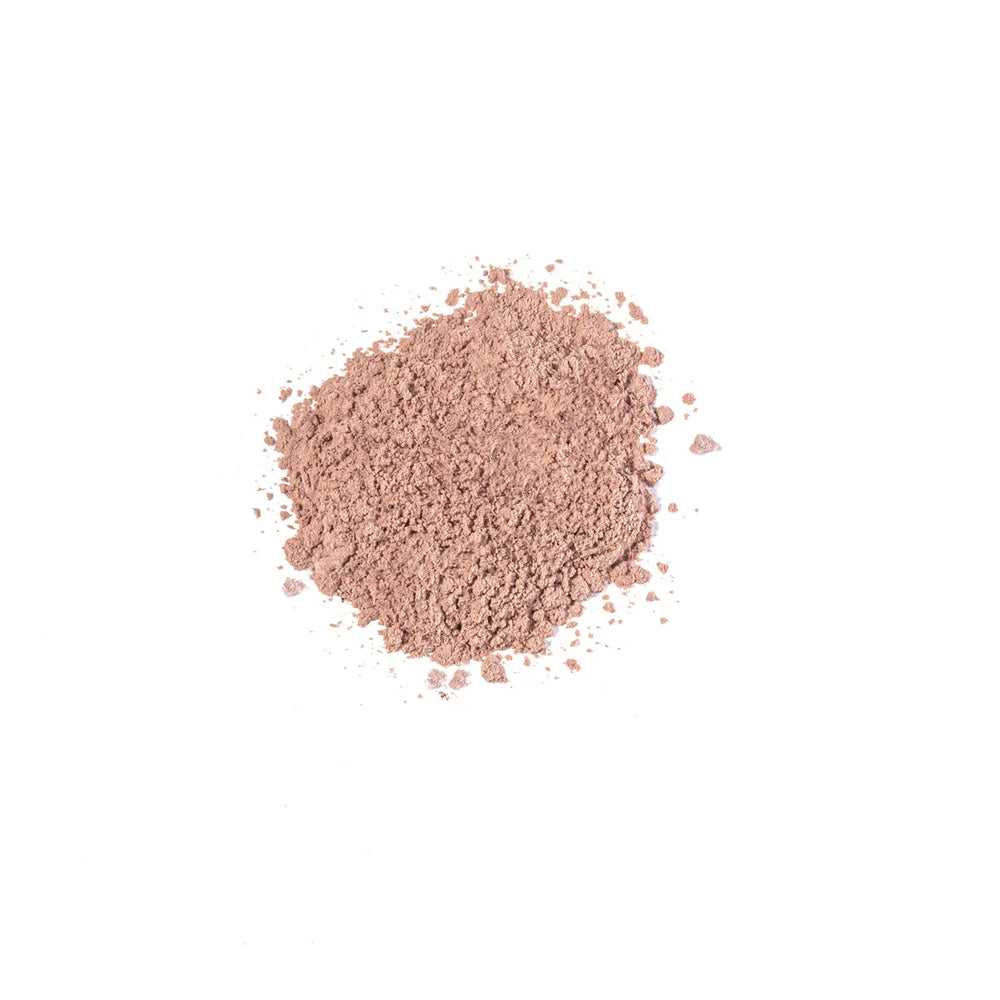 Loose beige powder of iS Clinical PerfecTint Powder SPF 40 on a white background