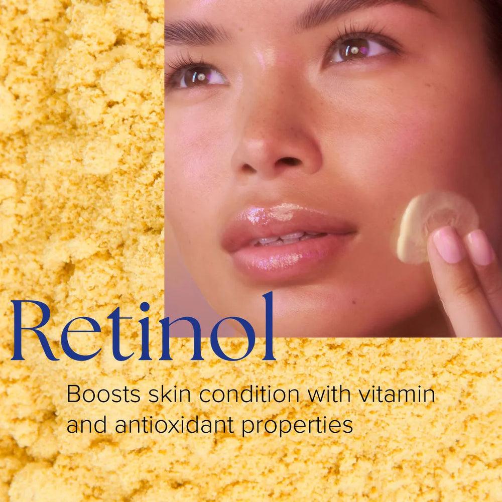 Close-up of woman applying creamy beige Retinol+ Emulsion 0.3 to cheek, yellow powder background
