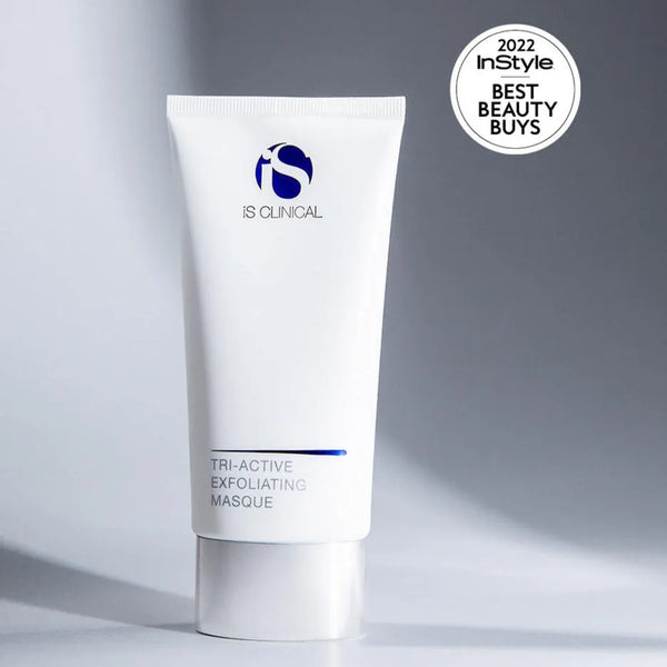 White tube of iS Clinical Tri-Active Exfoliating Masque with blue logo on grey background