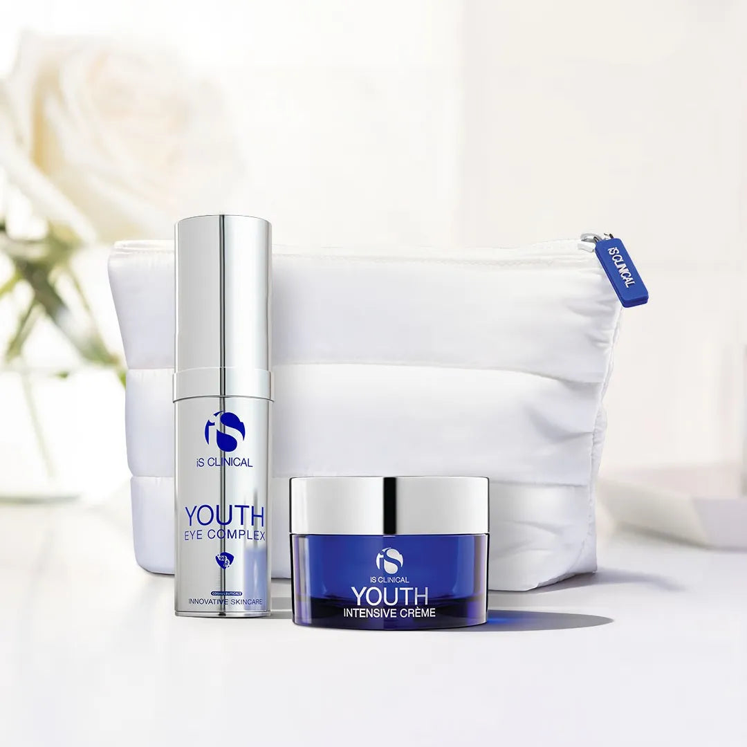 iS Clinical Youth Eye Complex pump bottle and Youth Intensive Crème jar with white cosmetic bag